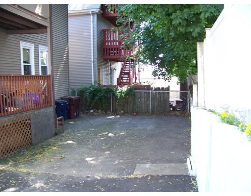 16 Chatham Road Everett, MA 02149 - Photo 20 of 28 a view of a house with a yard and a garage