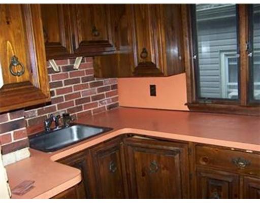 16 Chatham Road Everett, MA 02149 - Photo 3 of 28 a kitchen with granite countertop a sink and a stove