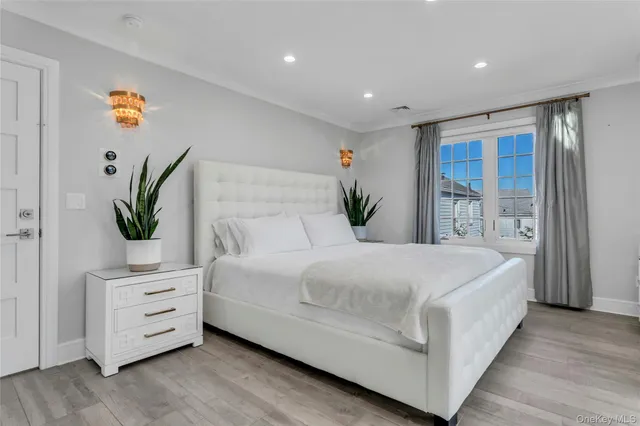 a bedroom with bed and window