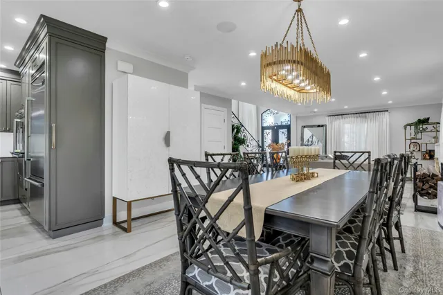 a dining room with furniture and window