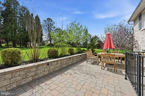 a patio with table and chairs