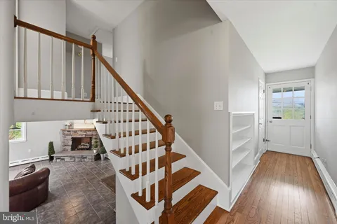 a view of entryway with wooden floor