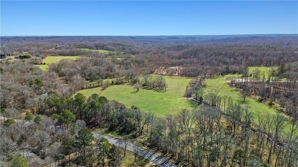 0 New Kings Bridge Road Athens, GA 30607 - Photo 10 of 30 a view of a lush green forest with trees and some houses