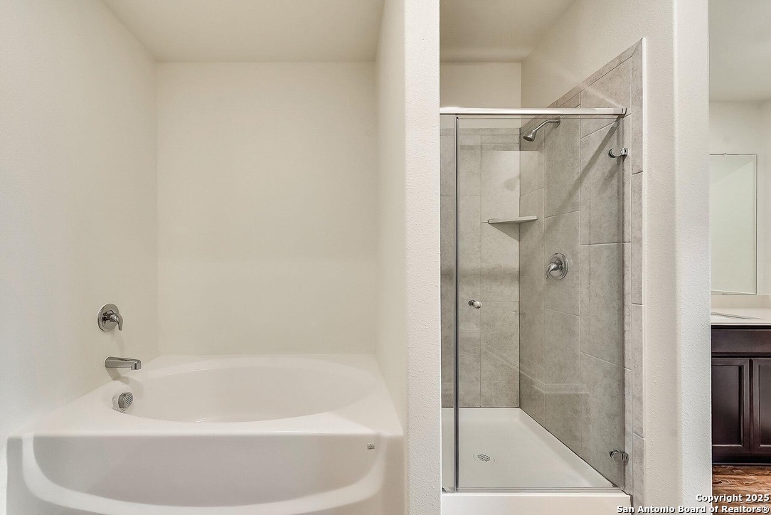 3139 Rosalind Way San Antonio, TX 78222 - Photo 11 of 14 a white bath tub sitting next to a shower