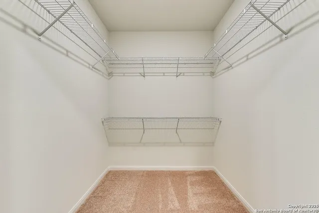 a view of a room with racks on the wall