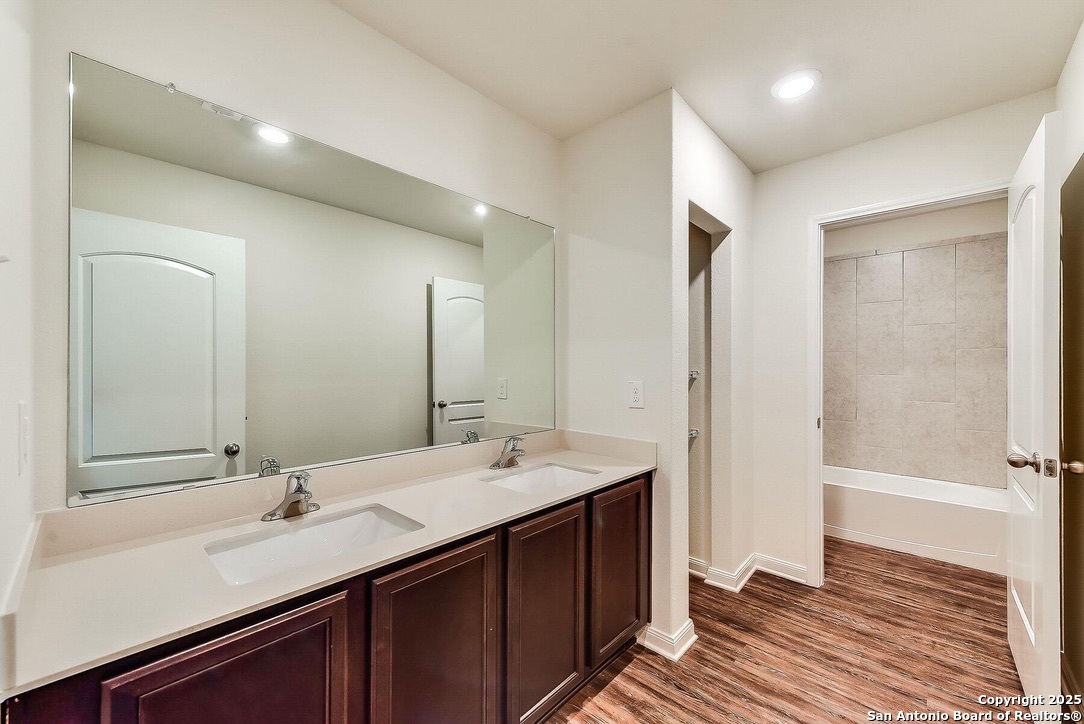 3139 Rosalind Way San Antonio, TX 78222 - Photo 14 of 14 a bathroom with a sink and a mirror