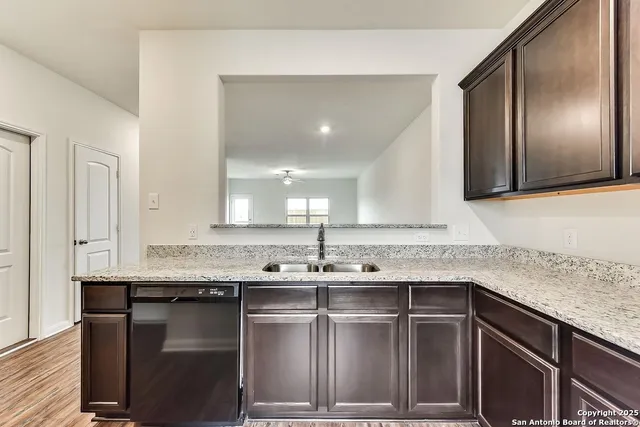 a kitchen with a sink and cabinets