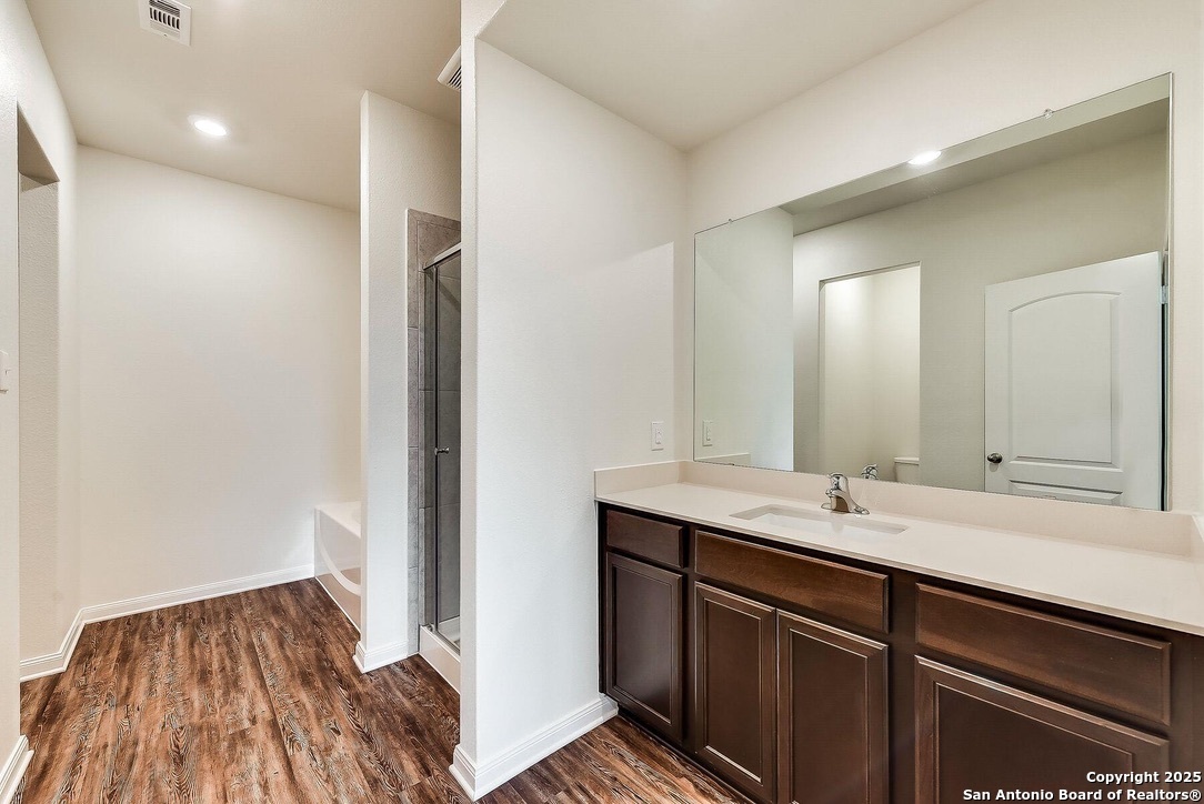 3139 Rosalind Way San Antonio, TX 78222 - Photo 10 of 14 a bathroom with a sink and a mirror