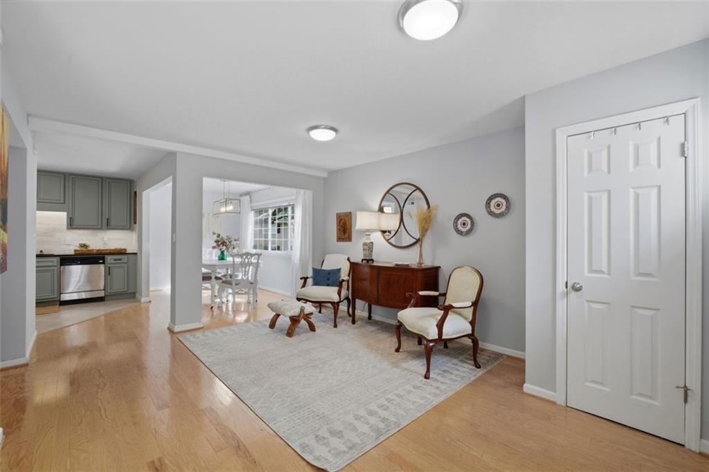 1468 Briarwood Road Northeast, Unit 901 Atlanta, GA 30319 - Photo 13 of 27 a living room with furniture and a table