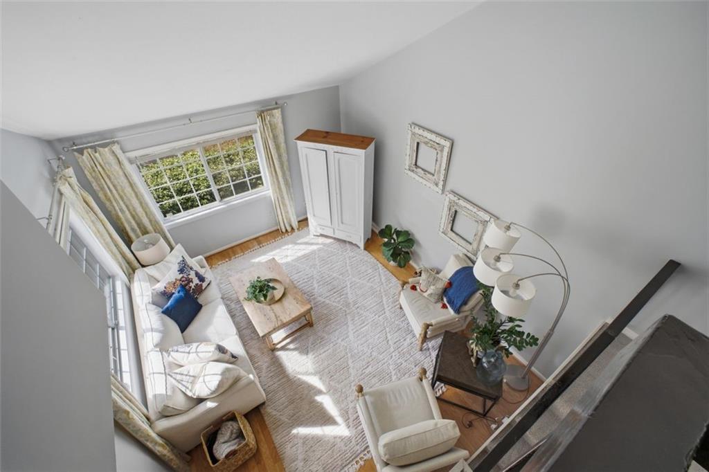 1468 Briarwood Road Northeast, Unit 901 Atlanta, GA 30319 - Photo 16 of 27 a living room with furniture and flowers
