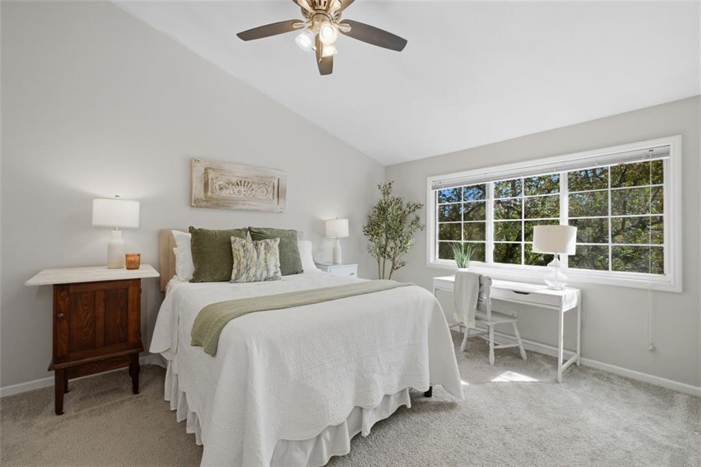1468 Briarwood Road Northeast, Unit 901 Atlanta, GA 30319 - Photo 17 of 27 a bedroom with a bed and a window