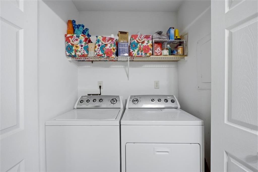 1468 Briarwood Road Northeast, Unit 901 Atlanta, GA 30319 - Photo 23 of 27 a utility room with dryer and washer