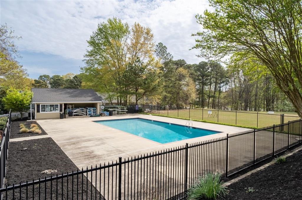 1468 Briarwood Road Northeast, Unit 901 Atlanta, GA 30319 - Photo 24 of 27 a view of a house with swimming pool