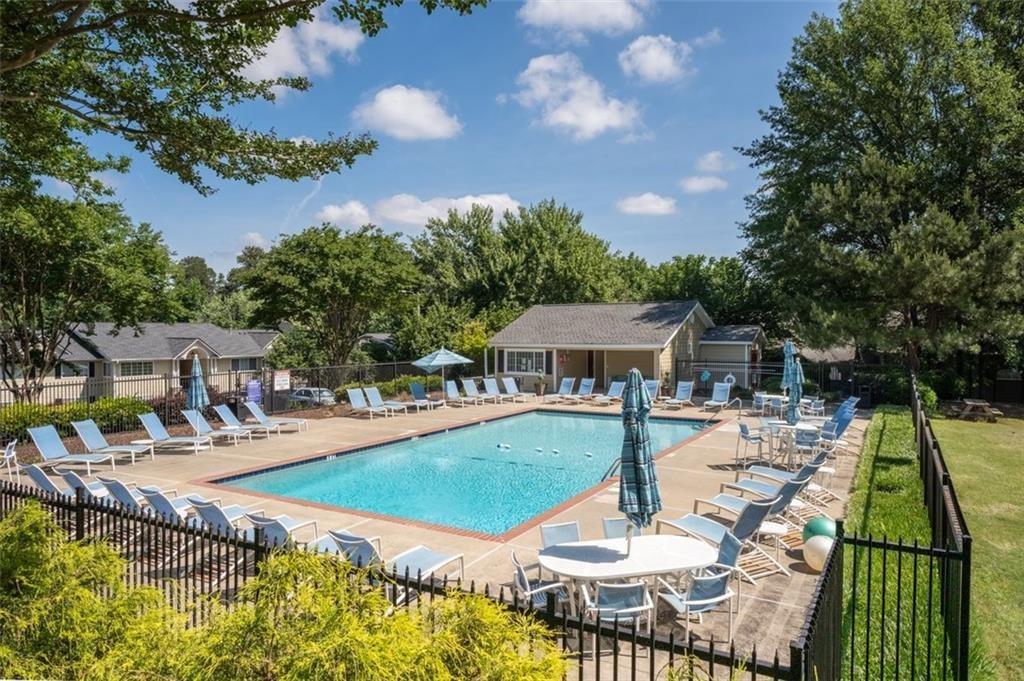 1468 Briarwood Road Northeast, Unit 901 Atlanta, GA 30319 - Photo 26 of 27 a view of a house with backyard patio and swimming pool