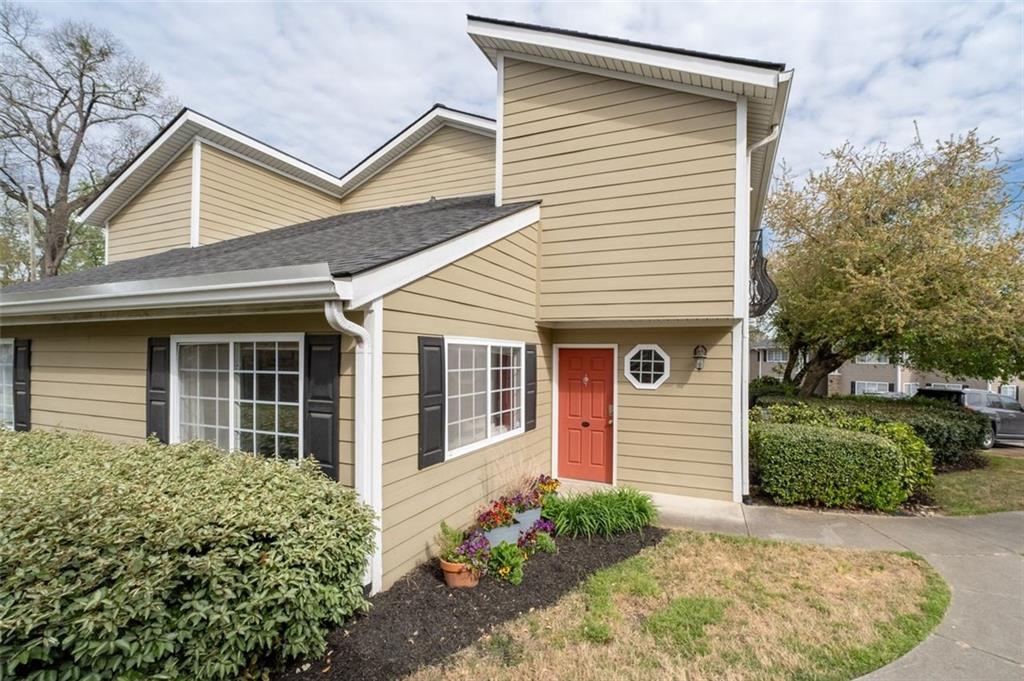 1468 Briarwood Road Northeast, Unit 901 Atlanta, GA 30319 - Photo 3 of 27 front view of a house with a yard