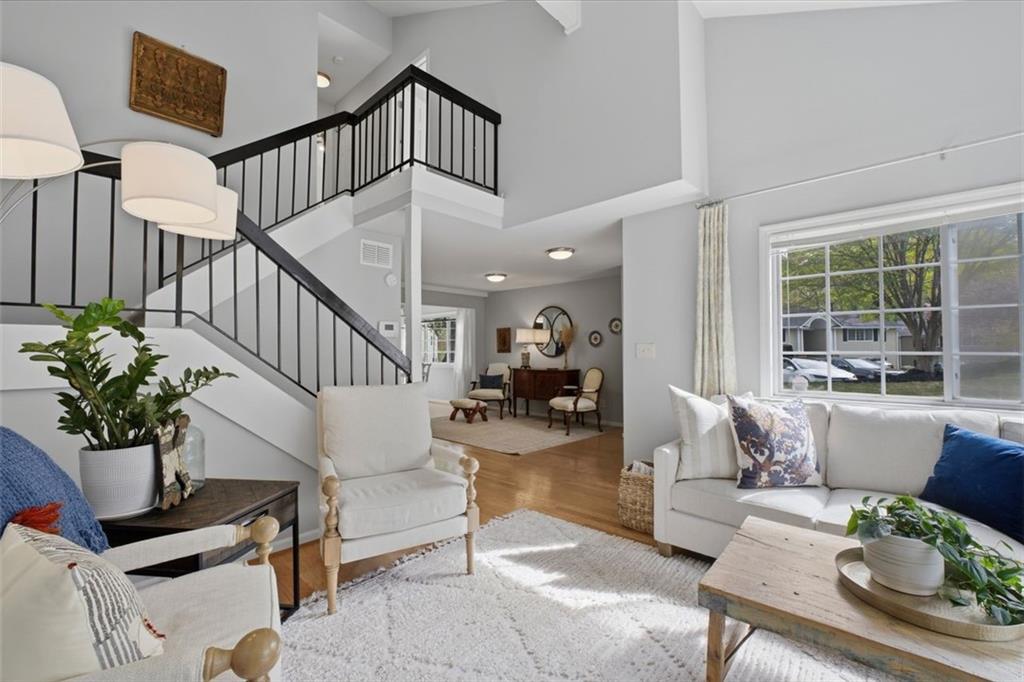 1468 Briarwood Road Northeast, Unit 901 Atlanta, GA 30319 - Photo 5 of 27 a living room with furniture and wooden floor