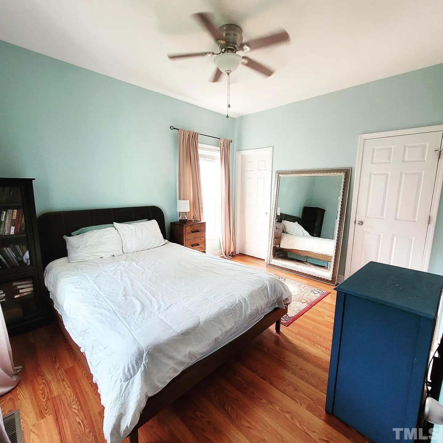 701 East Martin Street Raleigh, NC 27601 - Photo 11 of 15 a bedroom with a bed and a large window