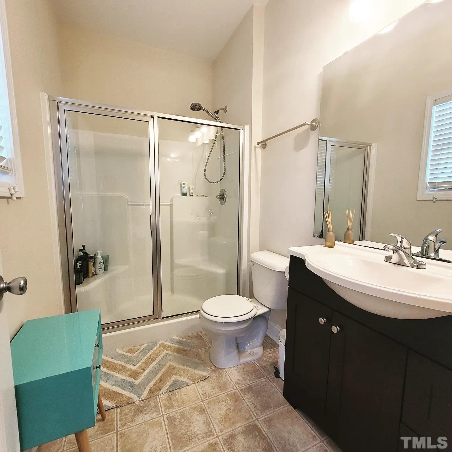 701 East Martin Street Raleigh, NC 27601 - Photo 12 of 15 a bathroom with a sink and a mirror