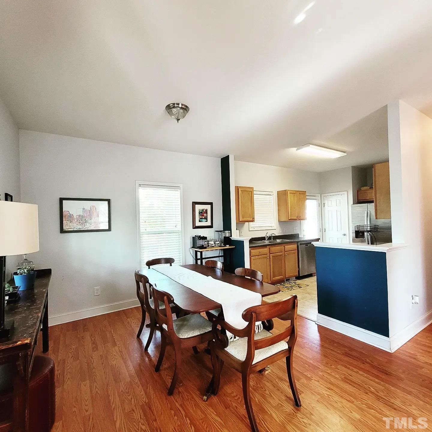 701 East Martin Street Raleigh, NC 27601 - Photo 4 of 15 a view of a dining room with furniture and wooden floor