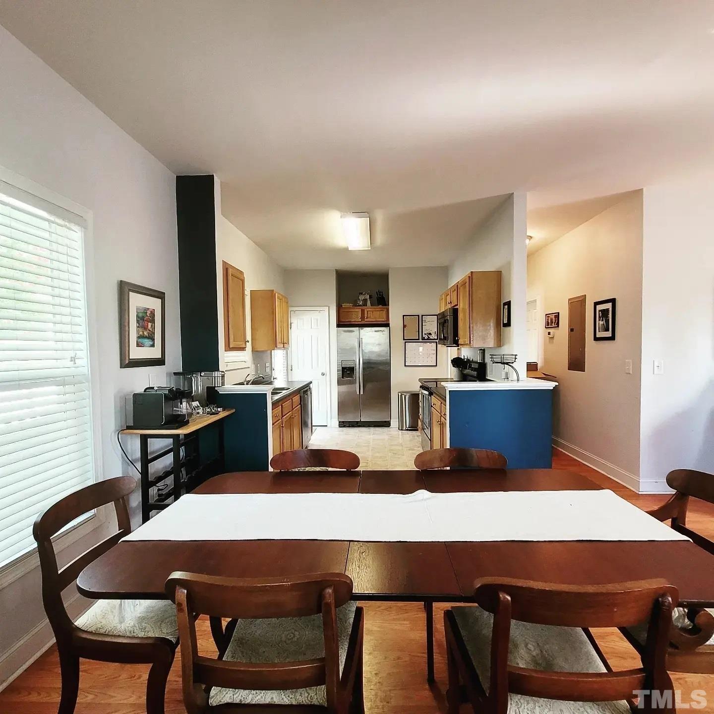 701 East Martin Street Raleigh, NC 27601 - Photo 5 of 15 a dining room with furniture and wooden floor