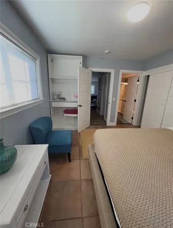 a room with a bed and furniture