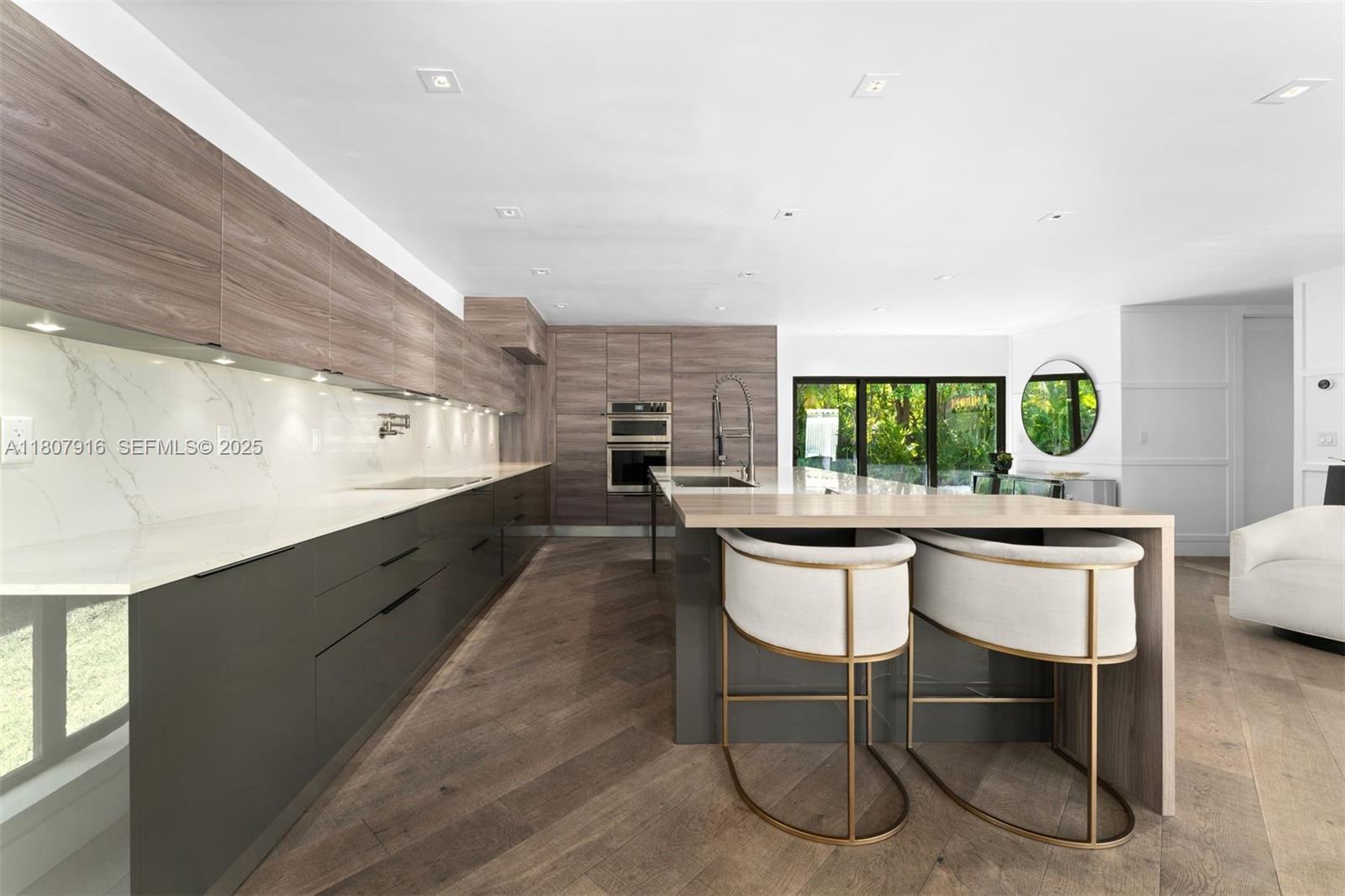 4250 Bay Point Road Miami, FL 33137 - Photo 11 of 43 a kitchen with a table and chairs in it