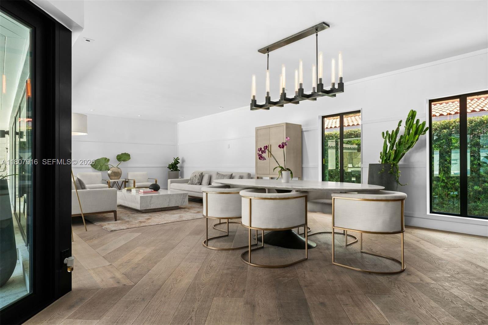 4250 Bay Point Road Miami, FL 33137 - Photo 13 of 43 a living room with furniture a rug entryway and a large window