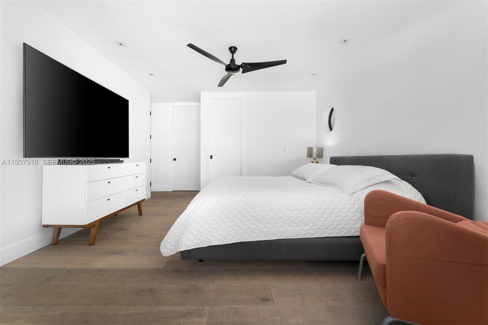 4250 Bay Point Road Miami, FL 33137 - Photo 14 of 43 a bedroom with bed and tv