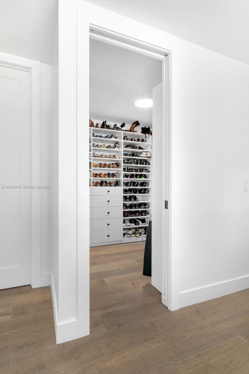 4250 Bay Point Road Miami, FL 33137 - Photo 15 of 43 a view of cabinet with wooden floor