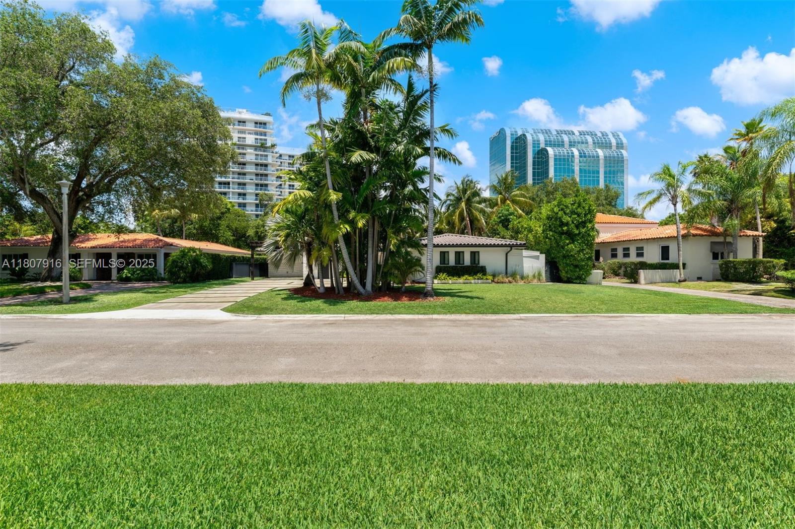 4250 Bay Point Road Miami, FL 33137 - Photo 2 of 43 a view of street with houses and trees