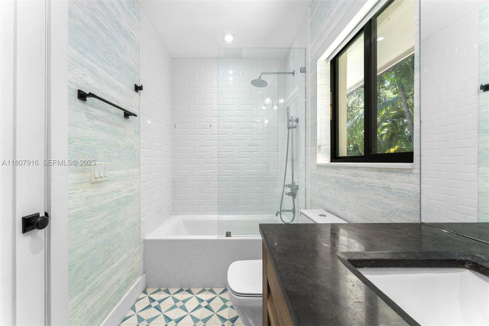 4250 Bay Point Road Miami, FL 33137 - Photo 23 of 43 a bathroom with a bathtub and a shower