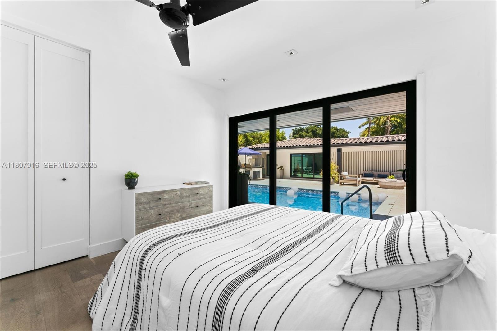 4250 Bay Point Road Miami, FL 33137 - Photo 24 of 43 a bedroom with a bed and a window