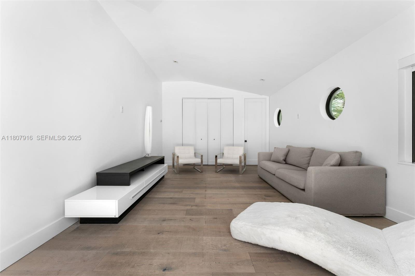 4250 Bay Point Road Miami, FL 33137 - Photo 26 of 43 a living room with furniture and a rug