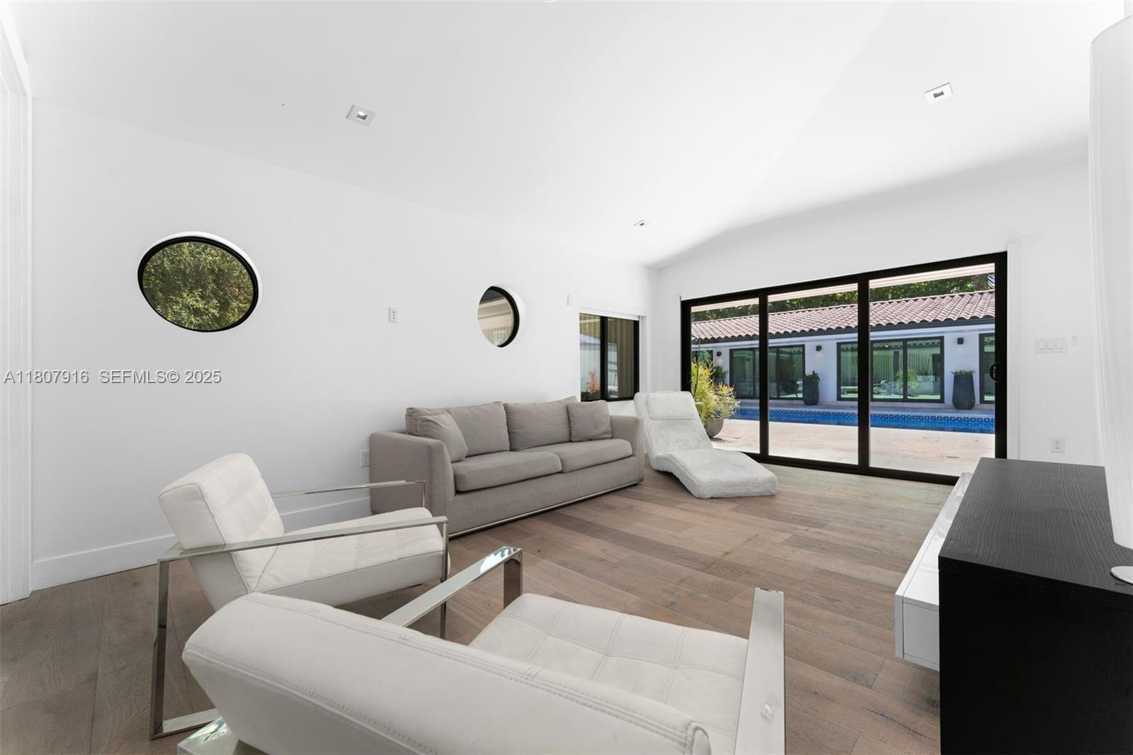 4250 Bay Point Road Miami, FL 33137 - Photo 27 of 43 a living room with furniture and a large window