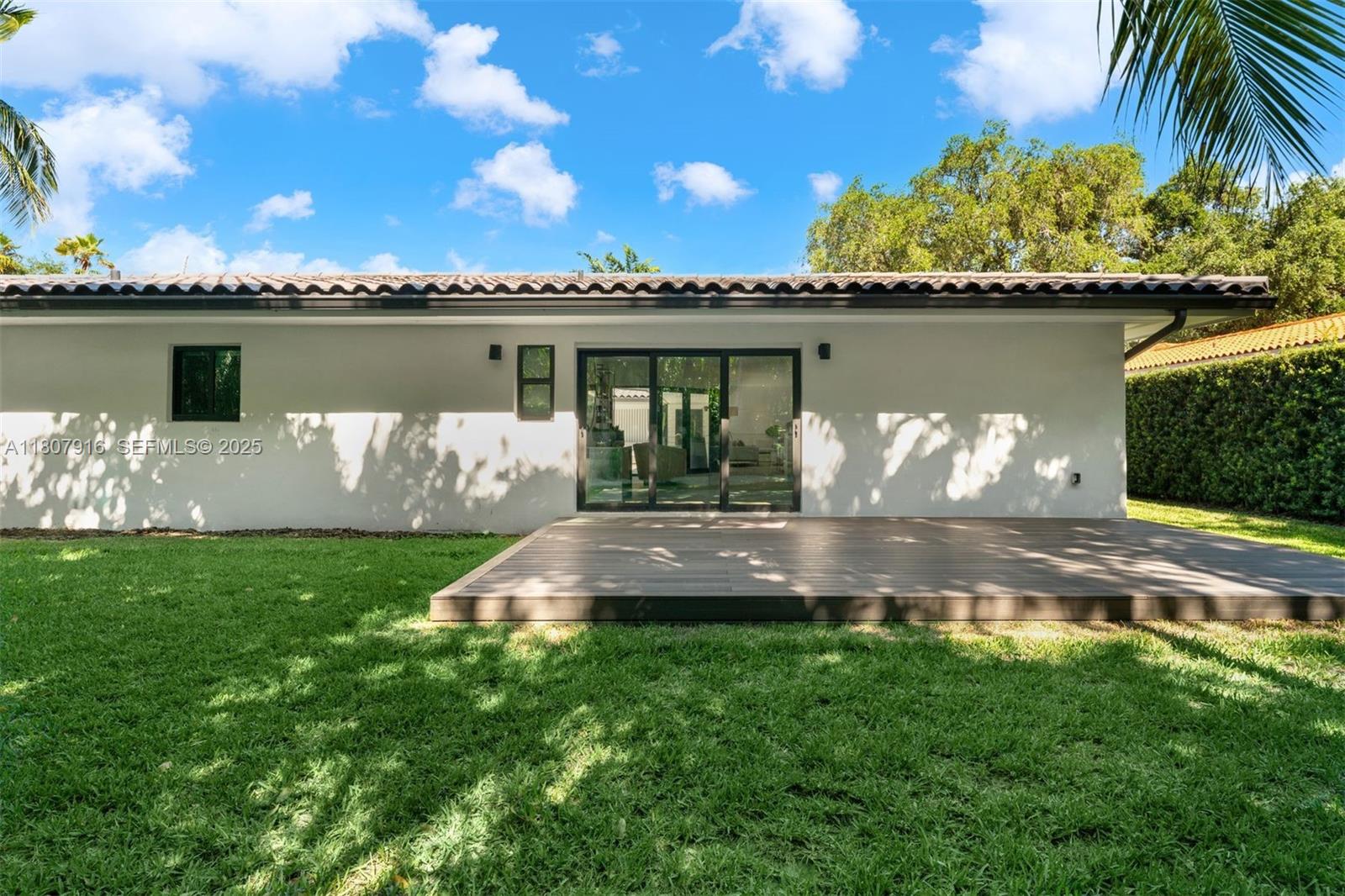 4250 Bay Point Road Miami, FL 33137 - Photo 33 of 43 a view of a house with a yard