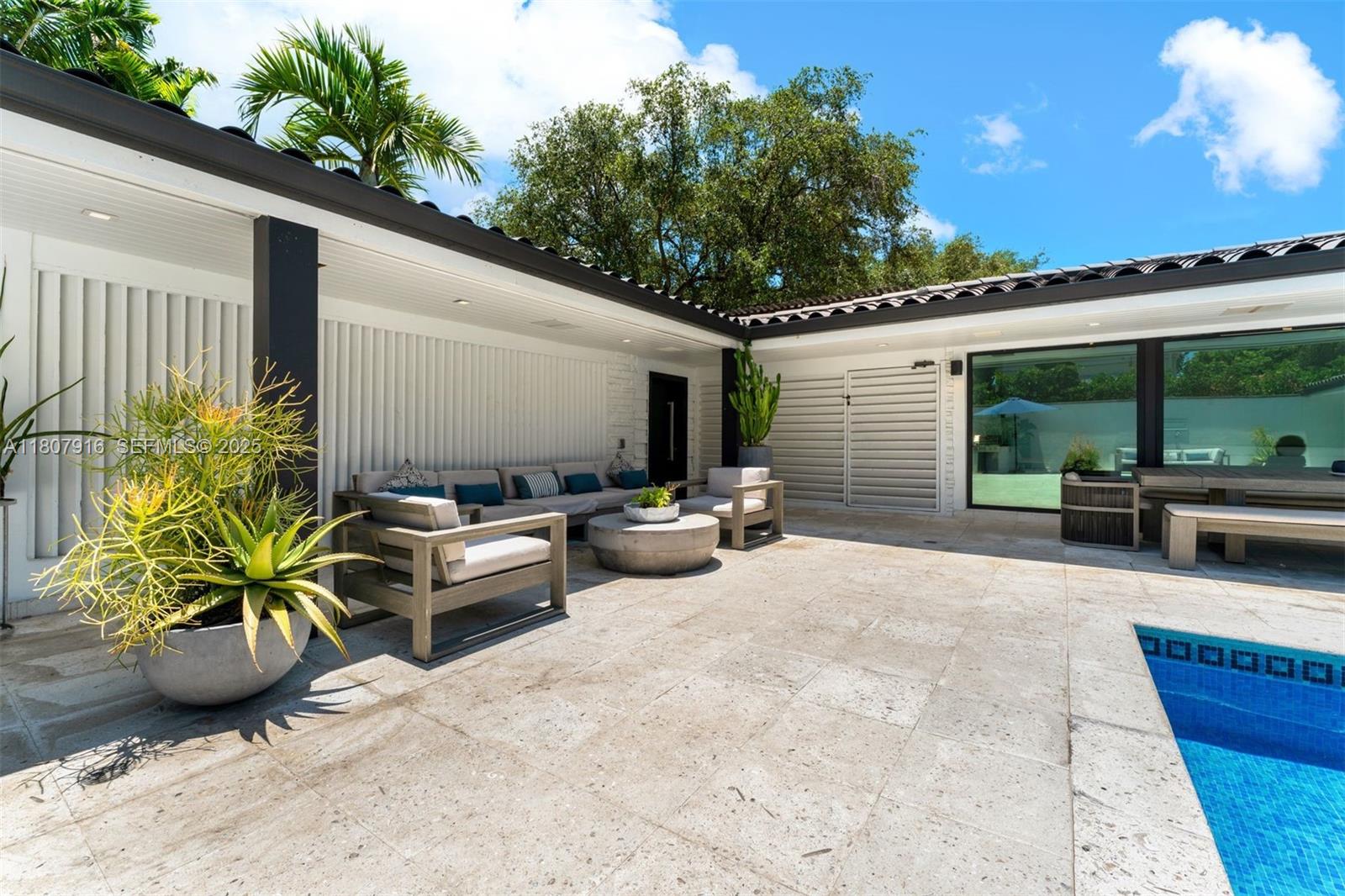 4250 Bay Point Road Miami, FL 33137 - Photo 37 of 43 a view of a patio with couches and potted plants