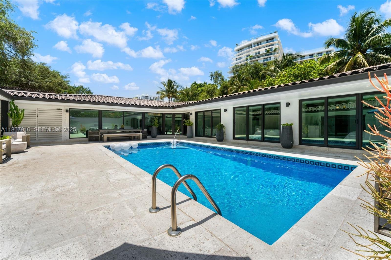 4250 Bay Point Road Miami, FL 33137 - Photo 39 of 43 a view of swimming pool with outdoor seating