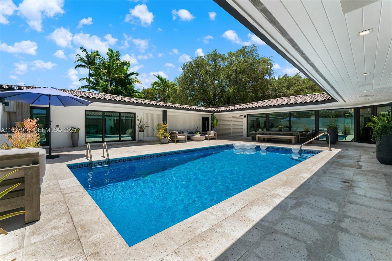 4250 Bay Point Road Miami, FL 33137 - Photo 40 of 43 a view of a house with swimming pool