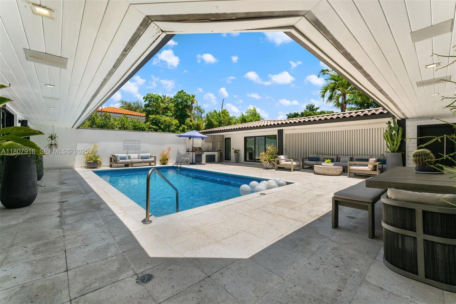 4250 Bay Point Road Miami, FL 33137 - Photo 43 of 43 a view of swimming pool with seating area and furniture