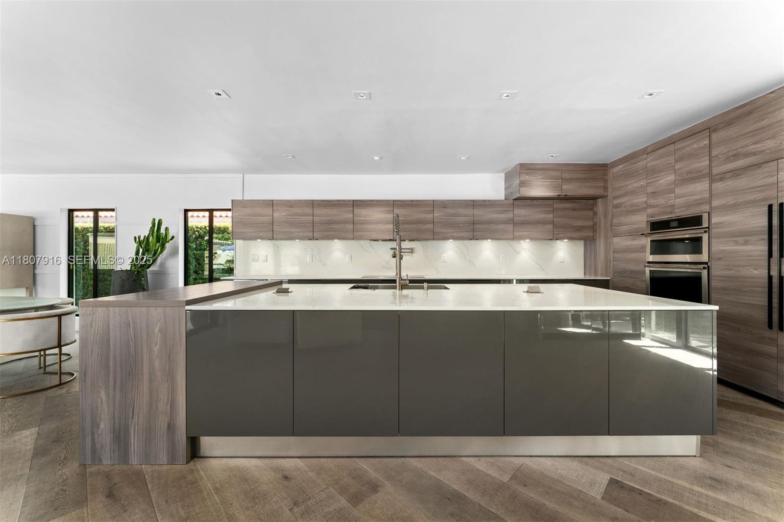 4250 Bay Point Road Miami, FL 33137 - Photo 8 of 43 a kitchen with a sink and cabinets