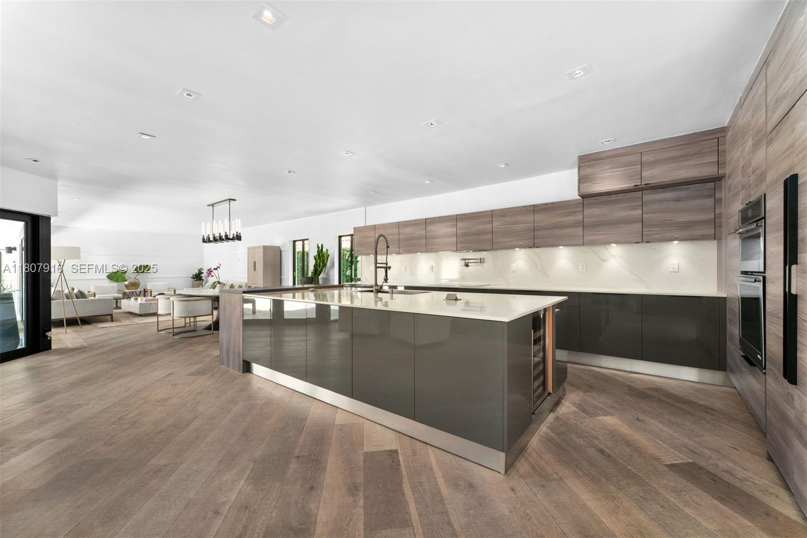 4250 Bay Point Road Miami, FL 33137 - Photo 9 of 43 a view of kitchen and kitchen with furniture stove and refrigerator