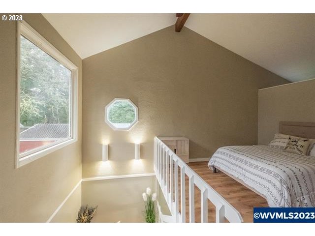 6057 Treehouse Road Monmouth, OR 97361 - Photo 15 of 32 a bedroom with a bed and a window