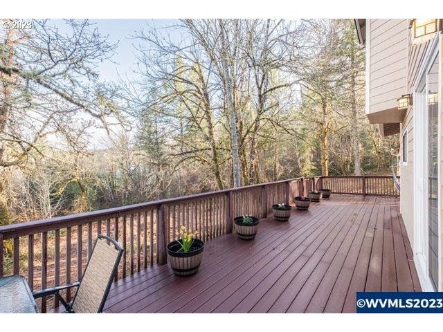6057 Treehouse Road Monmouth, OR 97361 - Photo 19 of 32 a view of balcony with deck and wooden floor