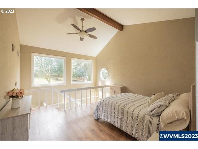 6057 Treehouse Road Monmouth, OR 97361 - Photo 29 of 32 a bedroom with a bed and a large window