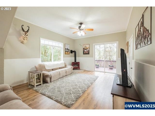 6057 Treehouse Road Monmouth, OR 97361 - Photo 6 of 32 a living room with furniture and a flat screen tv