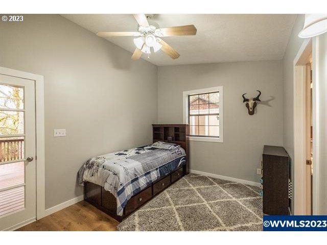 6057 Treehouse Road Monmouth, OR 97361 - Photo 9 of 32 a bedroom with a bed and a window