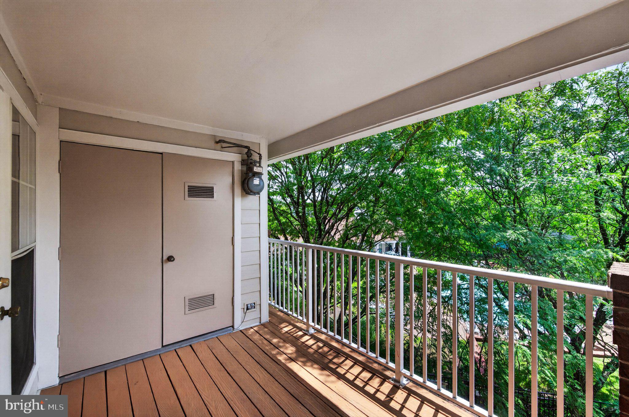 21029 Timber Ridge Terrace, Unit 302 Ashburn, VA 20147 - Photo 23 of 29 Serene balcony with lush green views.