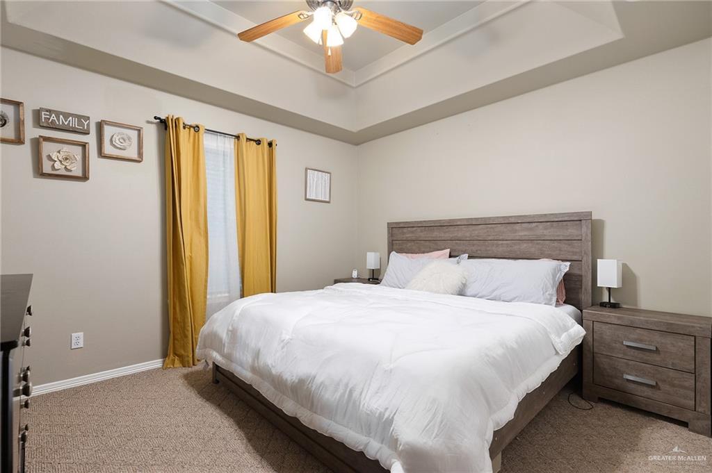 1311 Ima Street Edinburg, TX 78539 - Photo 10 of 11 a bedroom with a bed and a chandelier