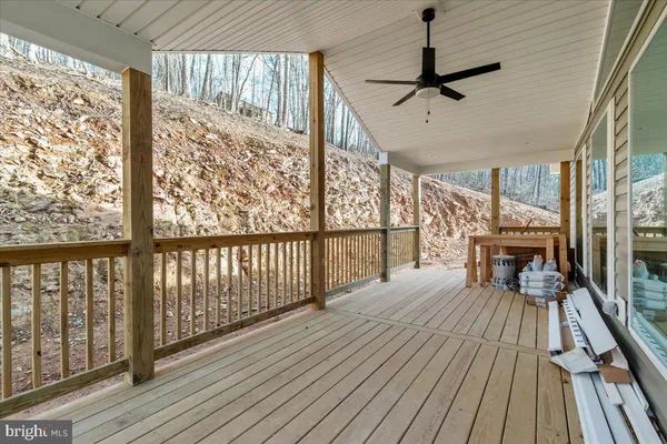 a view of a living room with wooden floor