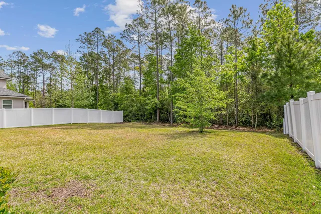 a view of a swimming pool with an outdoor space and seating area